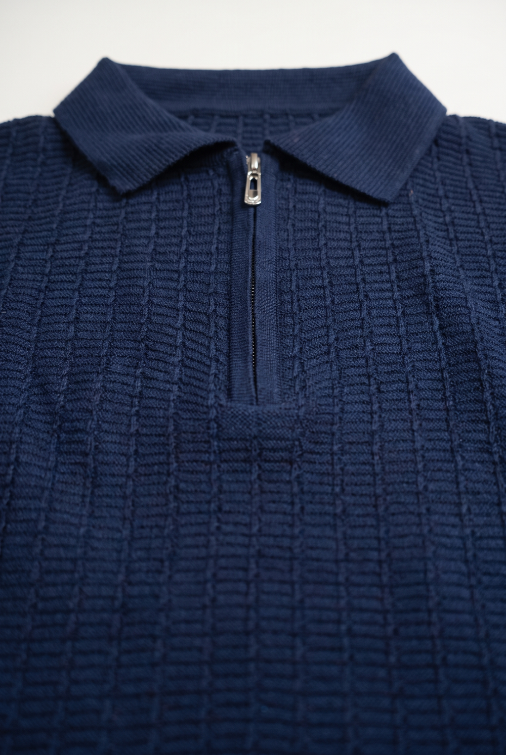 Navy Blue Textured Zip Knit Polo — collar and zip detail