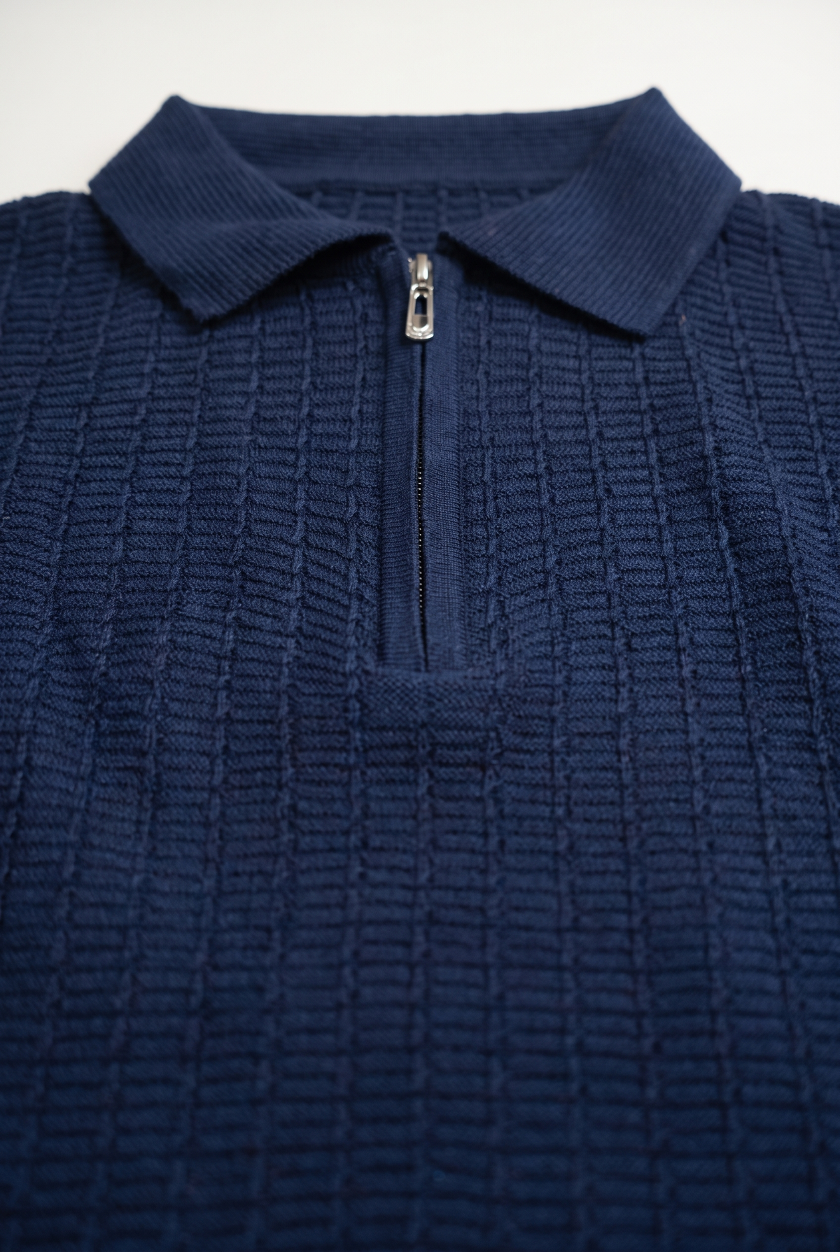 Navy Blue Textured Zip Knit Polo — collar and zip detail
